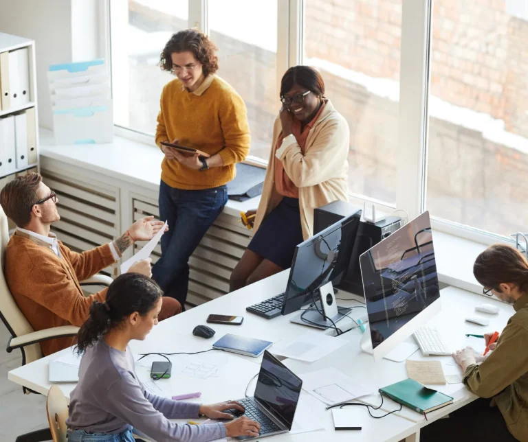 Team analyzing product launch strategy with digital tools and metrics.